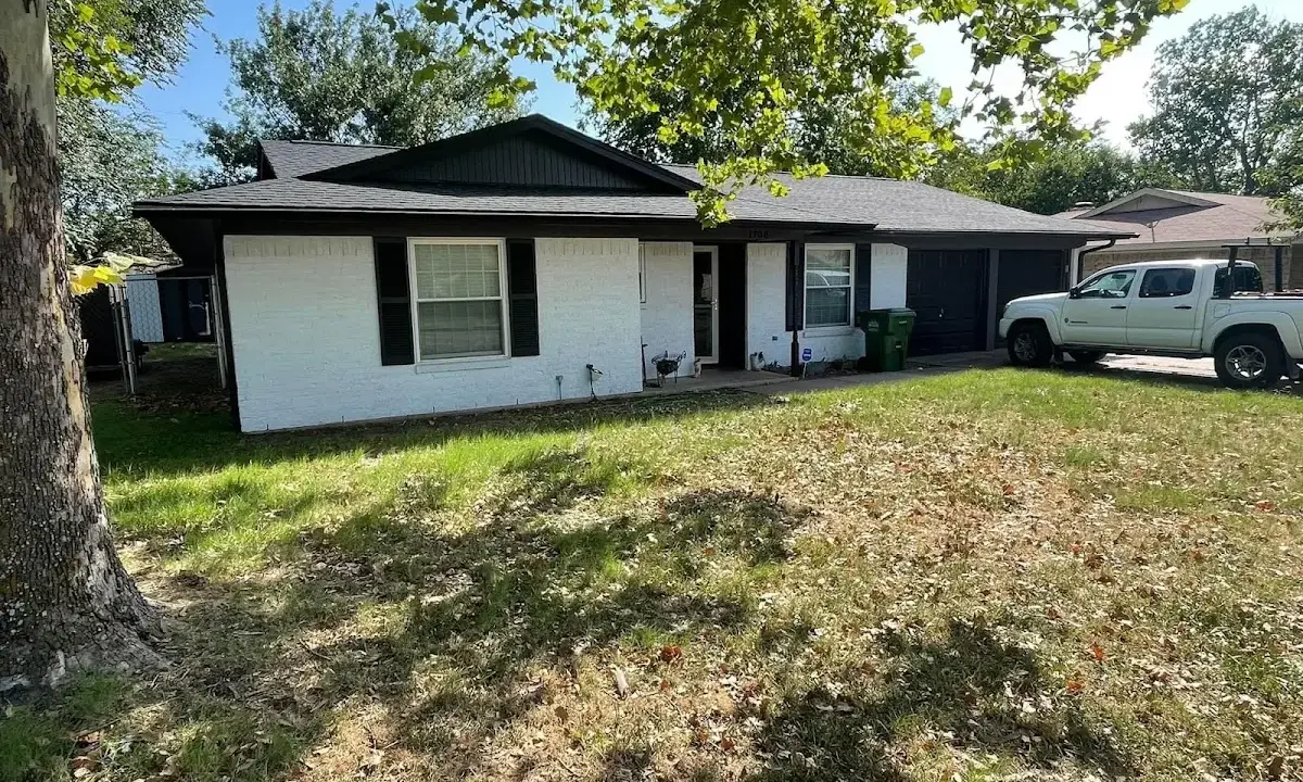 Professional roofing crew working on a residential roof in Credit River
